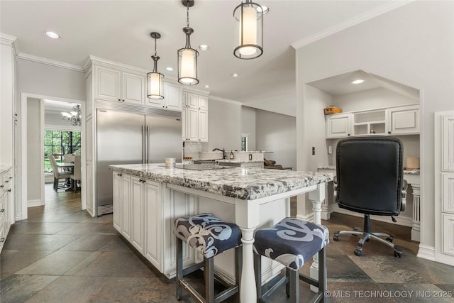5428 E 88th St, Tulsa, OK 74137 - kitchen with ornamental molding, built in fridge, recessed lighting, an island with sink, and open shelves