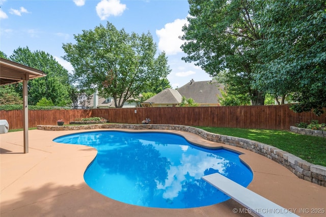 5428 E 88th St, Tulsa, OK 74137 - view of swimming pool with a patio area, a fenced backyard, and a diving board