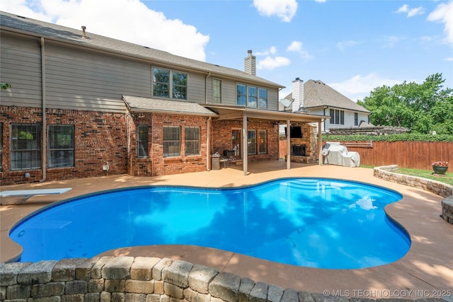 5428 E 88th St, Tulsa, OK 74137 - view of swimming pool featuring a patio area and a diving board