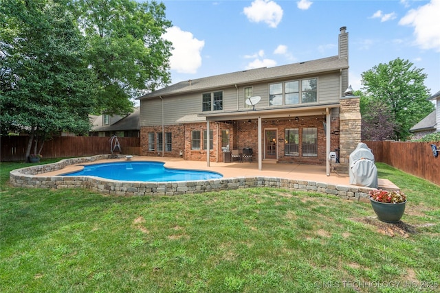 5428 E 88th St, Tulsa, OK 74137 - back of property with a fenced backyard, a chimney, a patio area, and brick siding