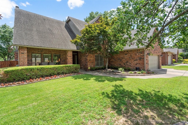 5428 E 88th St, Tulsa, OK 74137 - view of front of home featuring brick siding, concrete driveway, and roof with shingles