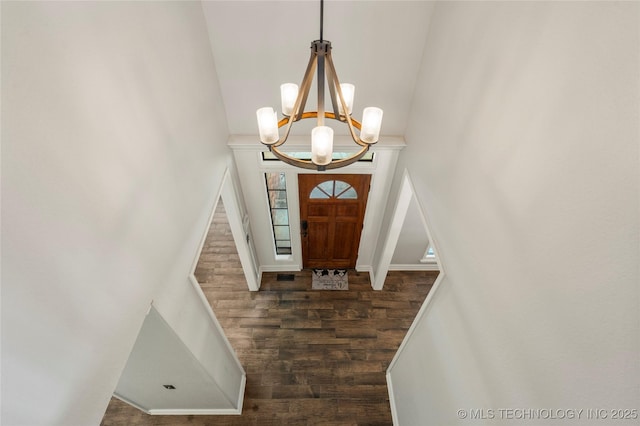 5428 E 88th St, Tulsa, OK 74137 - foyer entrance featuring wood finished floors, high vaulted ceiling, and a chandelier