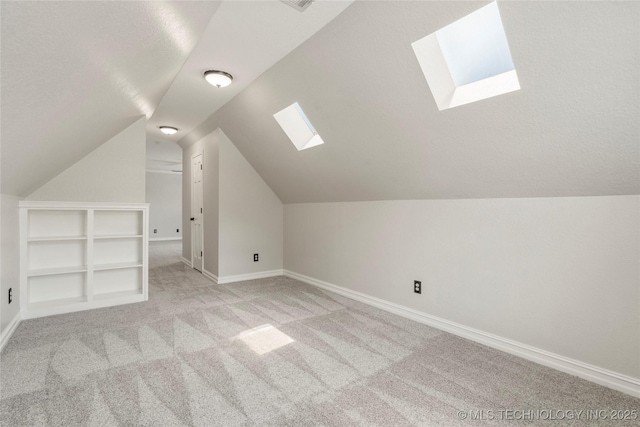 5428 E 88th St, Tulsa, OK 74137 - bonus room with a skylight, light carpet, and lofted ceiling
