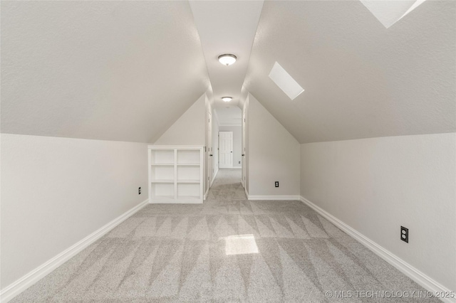 5428 E 88th St, Tulsa, OK 74137 - bonus room featuring light colored carpet, vaulted ceiling, and a skylight