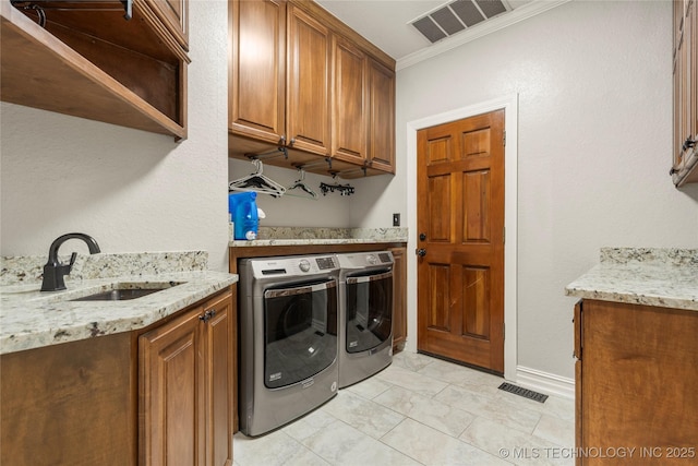 5428 E 88th St, Tulsa, OK 74137 - laundry area featuring separate washer and dryer, cabinet space, and crown molding