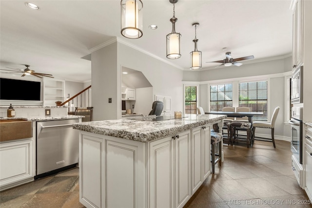 5428 E 88th St, Tulsa, OK 74137 - kitchen featuring a ceiling fan, appliances with stainless steel finishes, ornamental molding, open floor plan, and recessed lighting