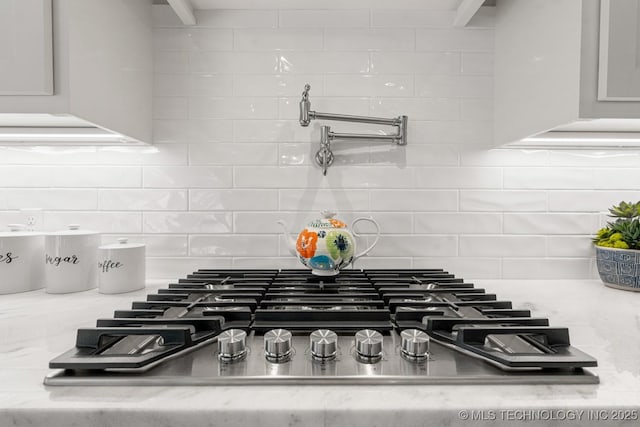 3905 S Elder Blvd, Broken Arrow, OK 74012 - kitchen view of pot filler, stainless steel gas cooktop, light countertops, and backsplash