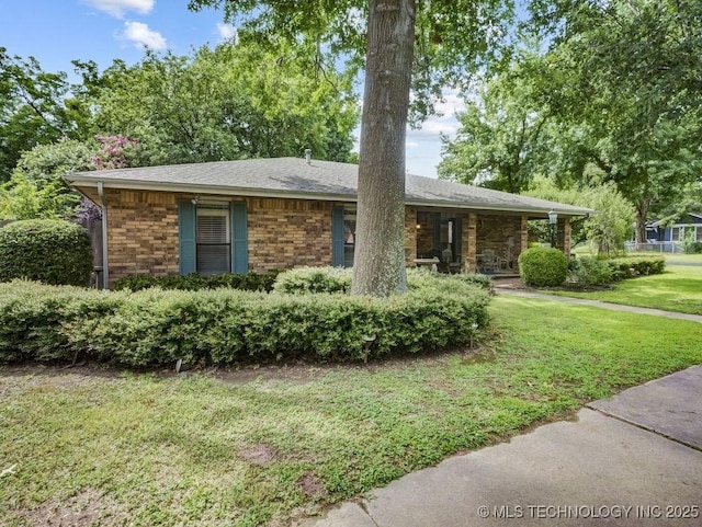 301 S Byrd, Coalgate, OK 74538 - ranch-style home with a front yard, covered porch, a shingled roof, and brick siding