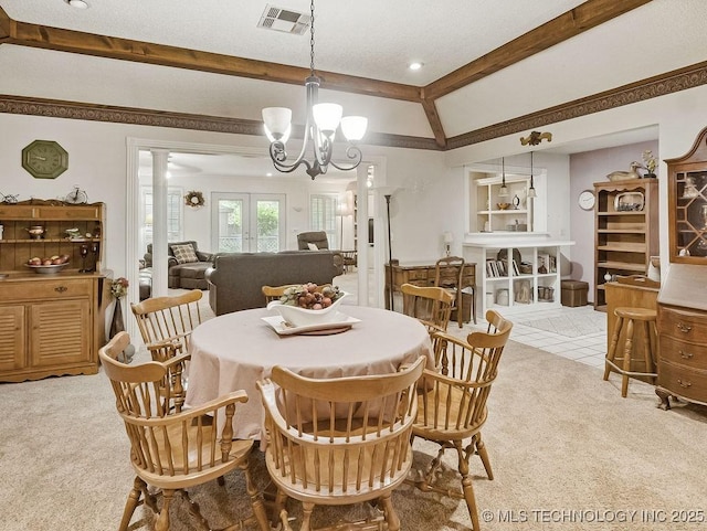 301 S Byrd, Coalgate, OK 74538 - dining room featuring light colored carpet, a chandelier, and decorative columns