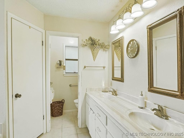 301 S Byrd, Coalgate, OK 74538 - full bathroom with double vanity, tile patterned flooring, and a textured ceiling