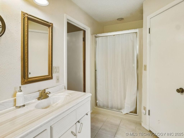 301 S Byrd, Coalgate, OK 74538 - full bathroom featuring vanity, a shower stall, tile patterned floors, and a textured ceiling
