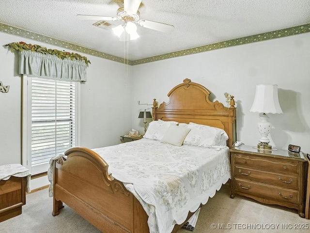 301 S Byrd, Coalgate, OK 74538 - bedroom with carpet floors, a textured ceiling, and ceiling fan