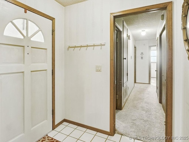 301 S Byrd, Coalgate, OK 74538 - entryway featuring a textured ceiling and light tile patterned floors