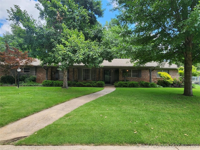 5135 S Marion Pl, Tulsa, OK 74135 - ranch-style house featuring a front lawn and brick siding