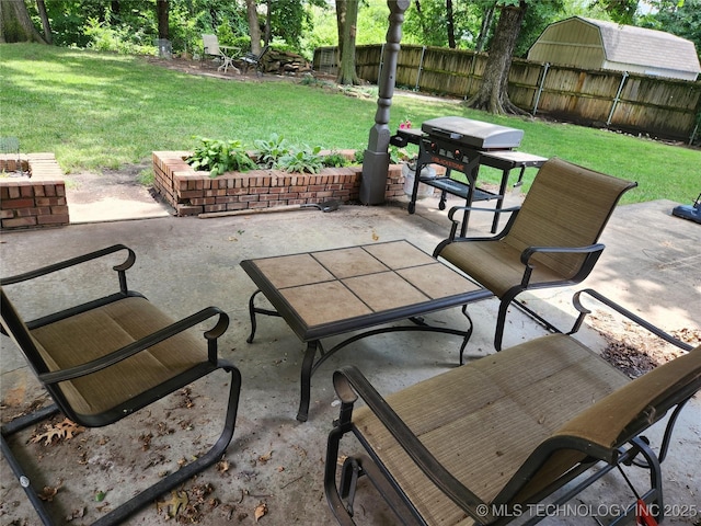 5135 S Marion Pl, Tulsa, OK 74135 - fenced backyard with a patio area and grilling area