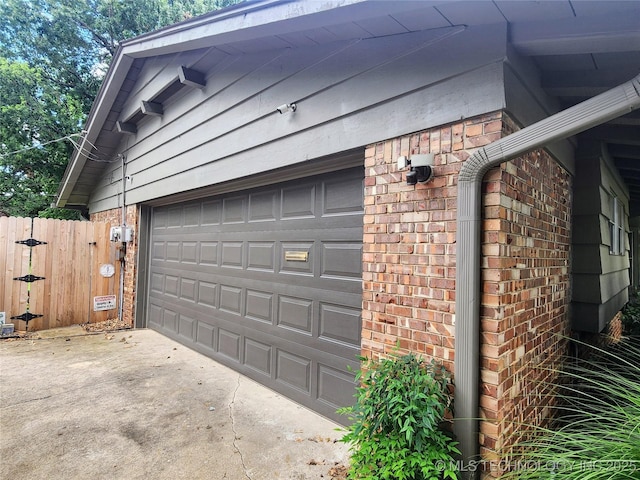 5135 S Marion Pl, Tulsa, OK 74135 - garage with concrete driveway and a gate