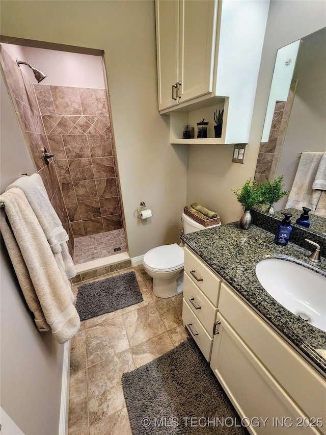 5135 S Marion Pl, Tulsa, OK 74135 - full bath featuring vanity, a tile shower, and stone finish floors