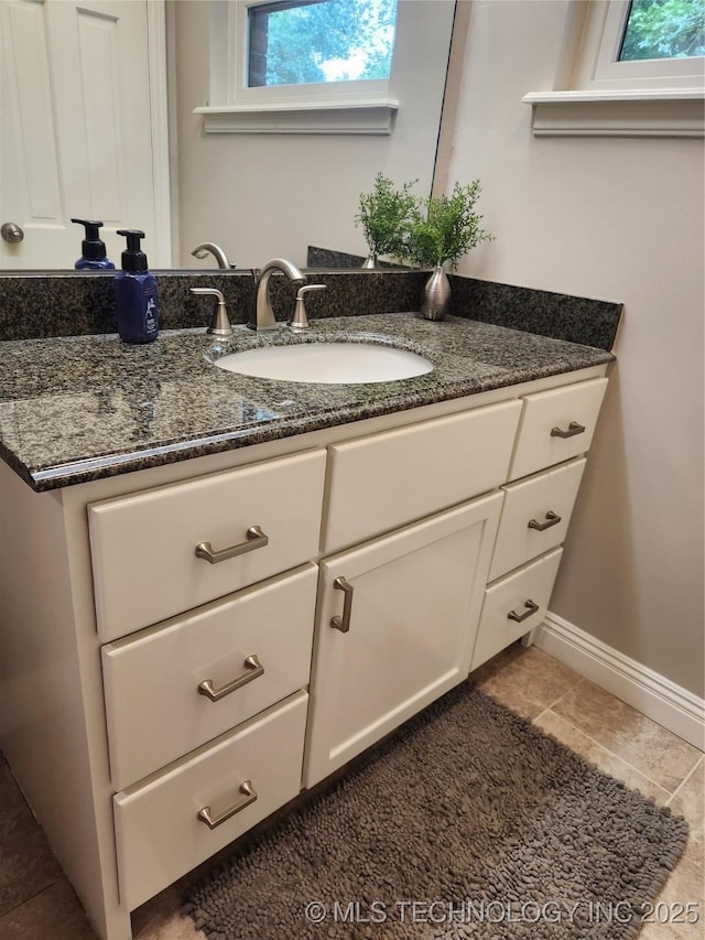 5135 S Marion Pl, Tulsa, OK 74135 - bathroom featuring vanity, healthy amount of natural light, and tile patterned flooring