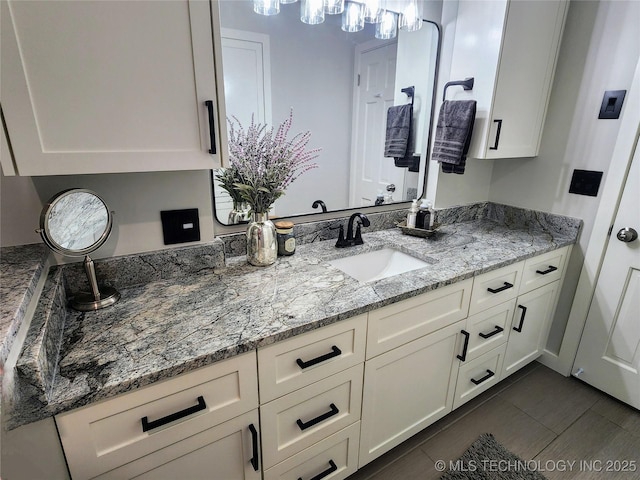 5135 S Marion Pl, Tulsa, OK 74135 - bathroom with vanity and a chandelier