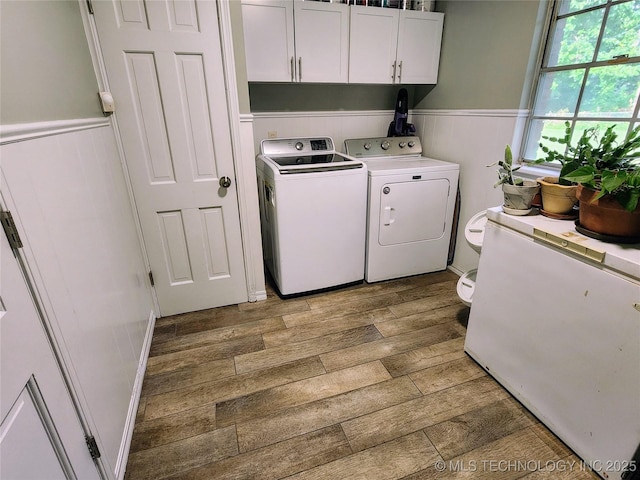 5135 S Marion Pl, Tulsa, OK 74135 - washroom featuring light wood-style floors, separate washer and dryer, and wainscoting