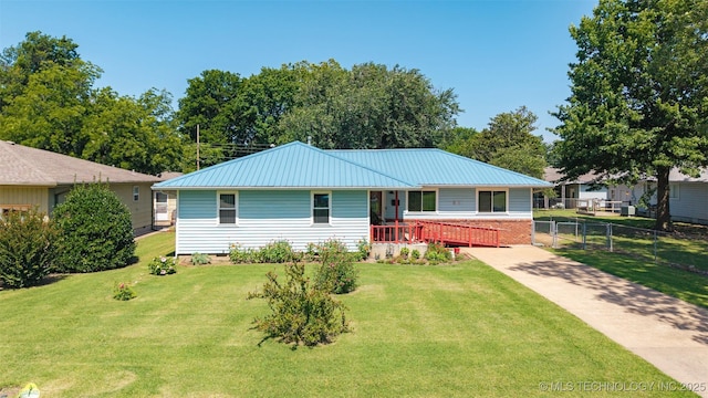 507 S Thompson, Vinita, OK 74301 - view of front facade with a metal roof, covered porch, and driveway