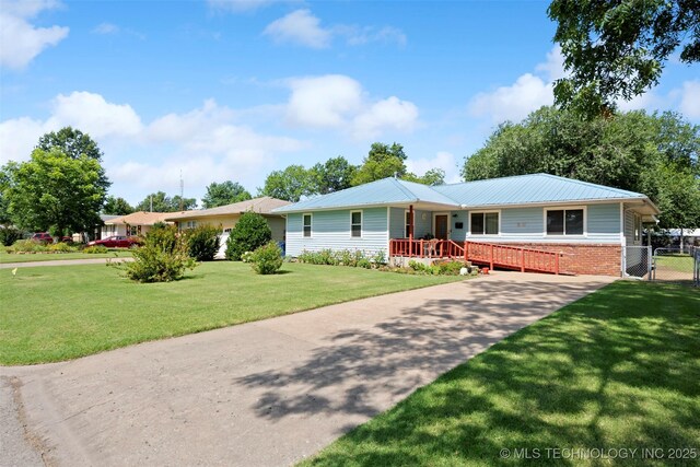 507 S Thompson, Vinita, OK 74301 - ranch-style home with a gate, a metal roof, and covered porch