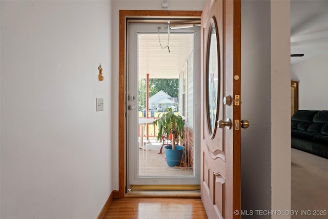 507 S Thompson, Vinita, OK 74301 - doorway to outside featuring wood finished floors