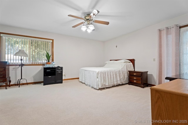507 S Thompson, Vinita, OK 74301 - bedroom with light carpet and ceiling fan