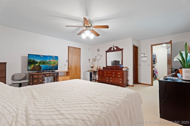 507 S Thompson, Vinita, OK 74301 - bedroom featuring light colored carpet, a ceiling fan, and a spacious closet