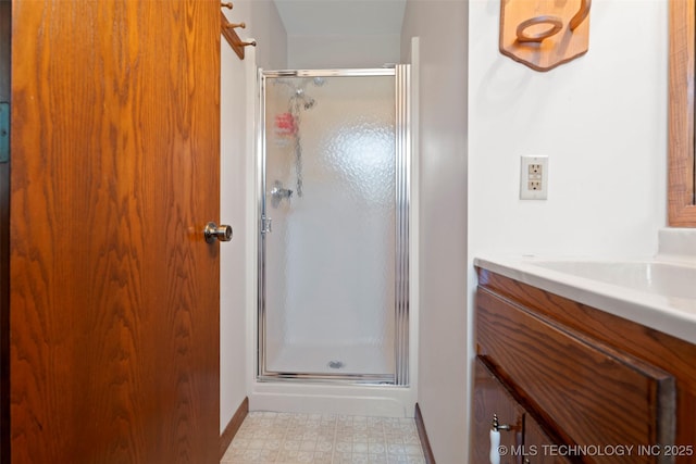 507 S Thompson, Vinita, OK 74301 - bathroom featuring a shower stall, vanity, and tile patterned floors