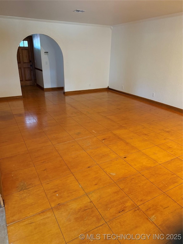 5616 S 91st E Ave, Tulsa, OK 74145 - empty room featuring arched walkways and baseboards