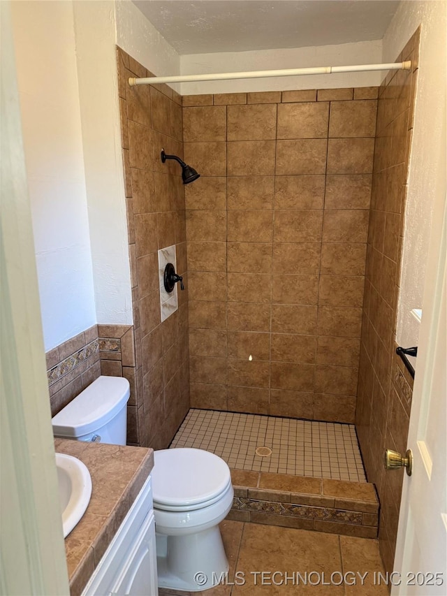 5616 S 91st E Ave, Tulsa, OK 74145 - bathroom featuring vanity, tiled shower, and tile patterned flooring