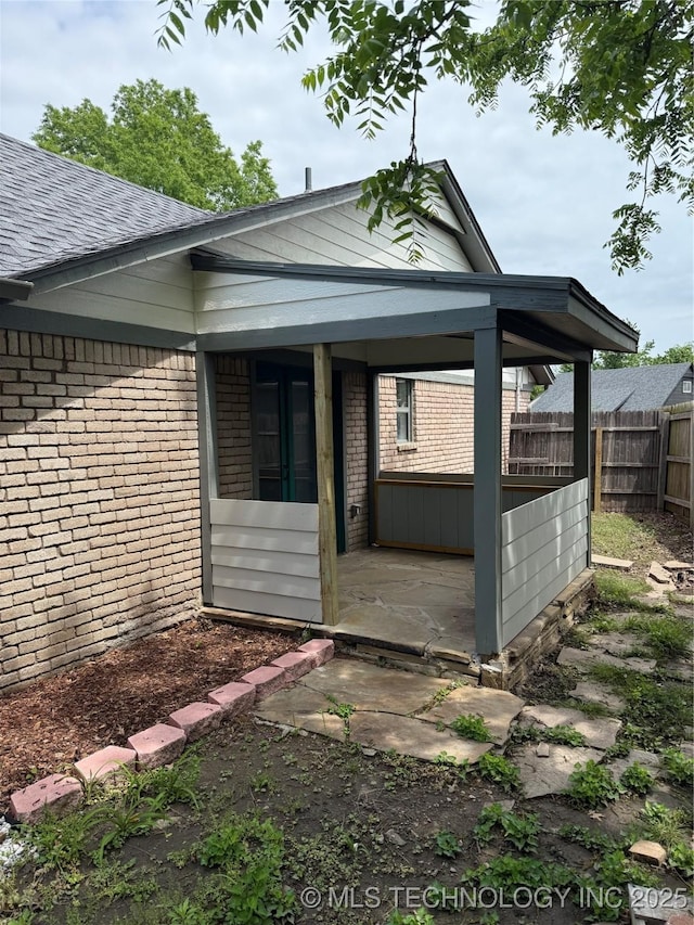5616 S 91st E Ave, Tulsa, OK 74145 - rear view of house featuring brick siding and a shingled roof