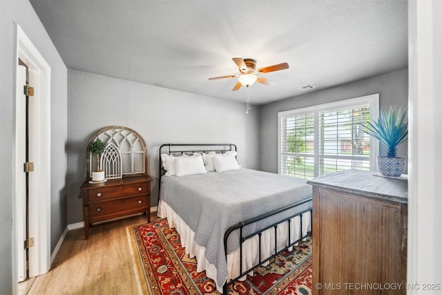 12708 E 78th St, Owasso, OK 74055 - bedroom featuring light wood-type flooring and a ceiling fan