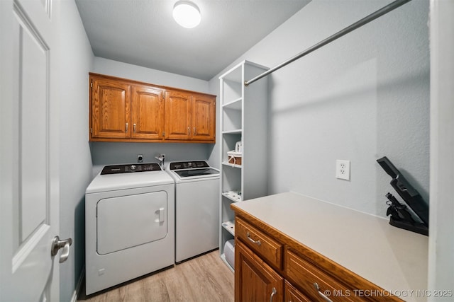12708 E 78th St, Owasso, OK 74055 - laundry room with cabinet space, washing machine and dryer, and light wood finished floors