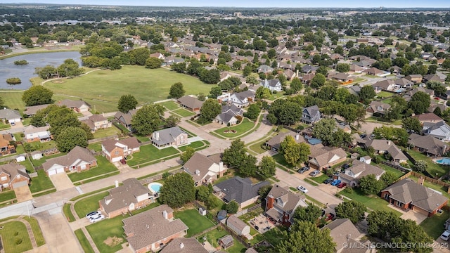 12708 E 78th St, Owasso, OK 74055 - aerial view of property's location with nearby suburban area and a nearby body of water