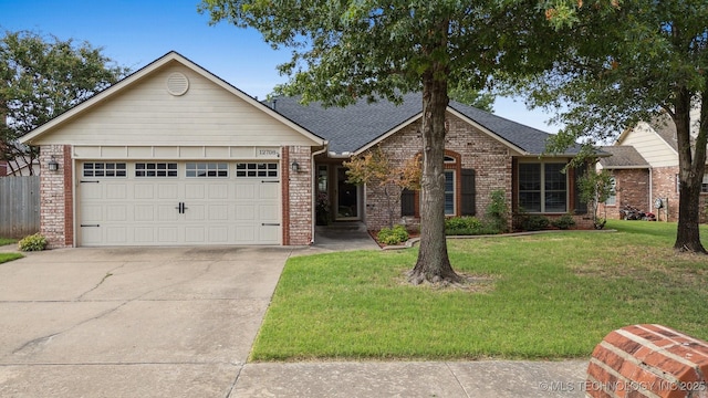 12708 E 78th St, Owasso, OK 74055 - ranch-style home with brick siding, a front lawn, concrete driveway, an attached garage, and roof with shingles