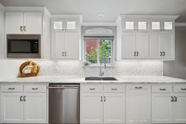 12708 E 78th St, Owasso, OK 74055 - kitchen featuring stainless steel appliances, white cabinets, crown molding, decorative backsplash, and light stone counters