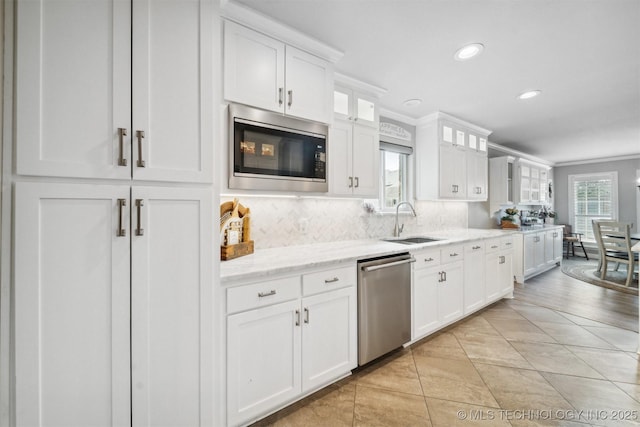 12708 E 78th St, Owasso, OK 74055 - kitchen with stainless steel appliances, tasteful backsplash, white cabinetry, recessed lighting, and glass insert cabinets