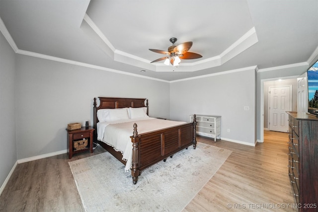 12708 E 78th St, Owasso, OK 74055 - bedroom with a raised ceiling, light wood-style flooring, a ceiling fan, and crown molding
