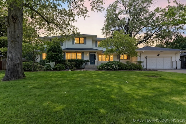 4146 S Birmingham Pl, Tulsa, OK 74105 - view of front facade featuring concrete driveway, a yard, and a garage