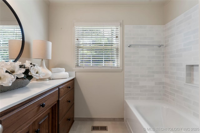4146 S Birmingham Pl, Tulsa, OK 74105 - bathroom with vanity, healthy amount of natural light, ornamental molding, and  shower combination