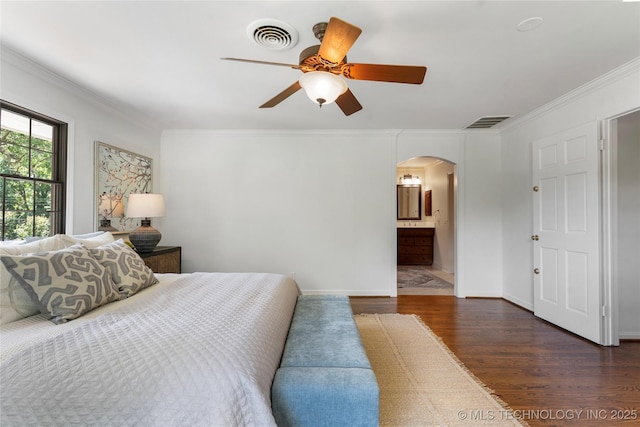4146 S Birmingham Pl, Tulsa, OK 74105 - bedroom featuring arched walkways, dark wood-style flooring, crown molding, a ceiling fan, and connected bathroom