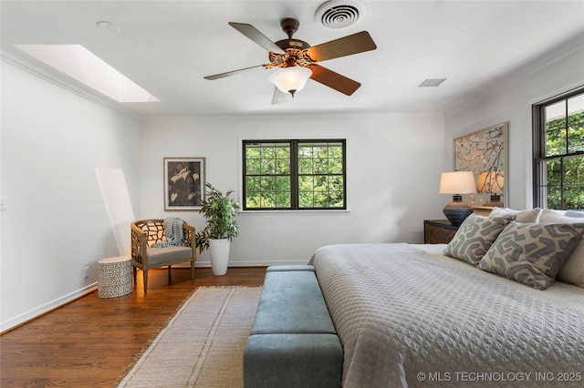 4146 S Birmingham Pl, Tulsa, OK 74105 - bedroom featuring a skylight, crown molding, wood finished floors, and ceiling fan