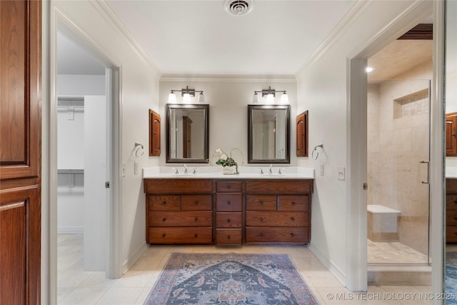 4146 S Birmingham Pl, Tulsa, OK 74105 - full bath with a stall shower, double vanity, a spacious closet, tile patterned floors, and ornamental molding