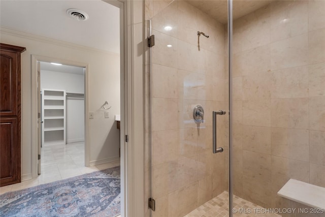 4146 S Birmingham Pl, Tulsa, OK 74105 - full bath featuring a shower stall, tile patterned floors, a walk in closet, and ornamental molding