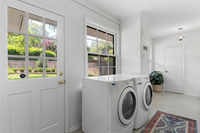4146 S Birmingham Pl, Tulsa, OK 74105 - laundry area with washing machine and dryer and healthy amount of natural light