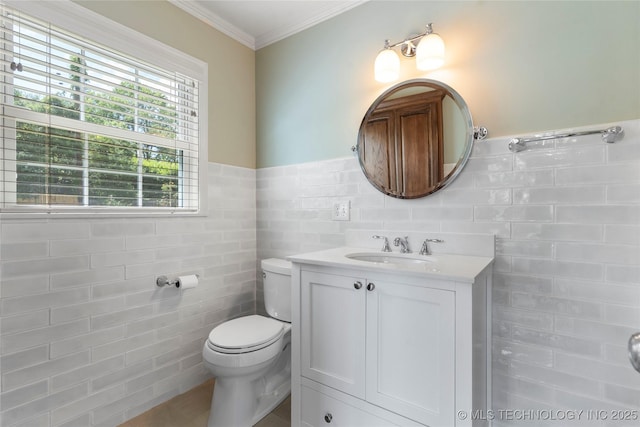 4146 S Birmingham Pl, Tulsa, OK 74105 - bathroom featuring tile walls, vanity, ornamental molding, and a wainscoted wall