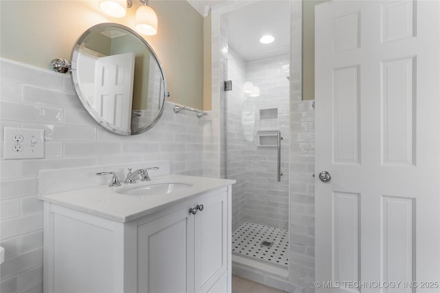 4146 S Birmingham Pl, Tulsa, OK 74105 - bathroom with a shower stall, vanity, and tile walls