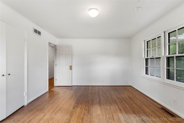 4146 S Birmingham Pl, Tulsa, OK 74105 - empty room with wood finished floors and ornamental molding